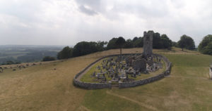An overhead view of an ancient Irish church, in ruins from age.